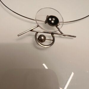 Alpaca silver, and crystal pendant on choker.